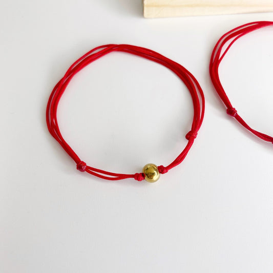 Pulsera de hilo con bola