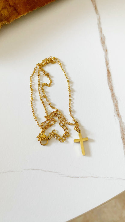 Cadena con cruz reversible