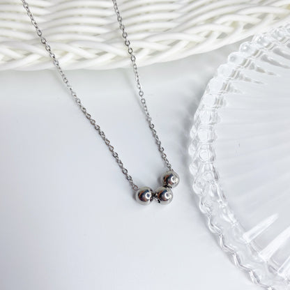 Cadena con tres bolas de acero