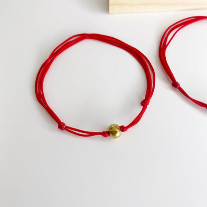 Pulsera de hilo con bola